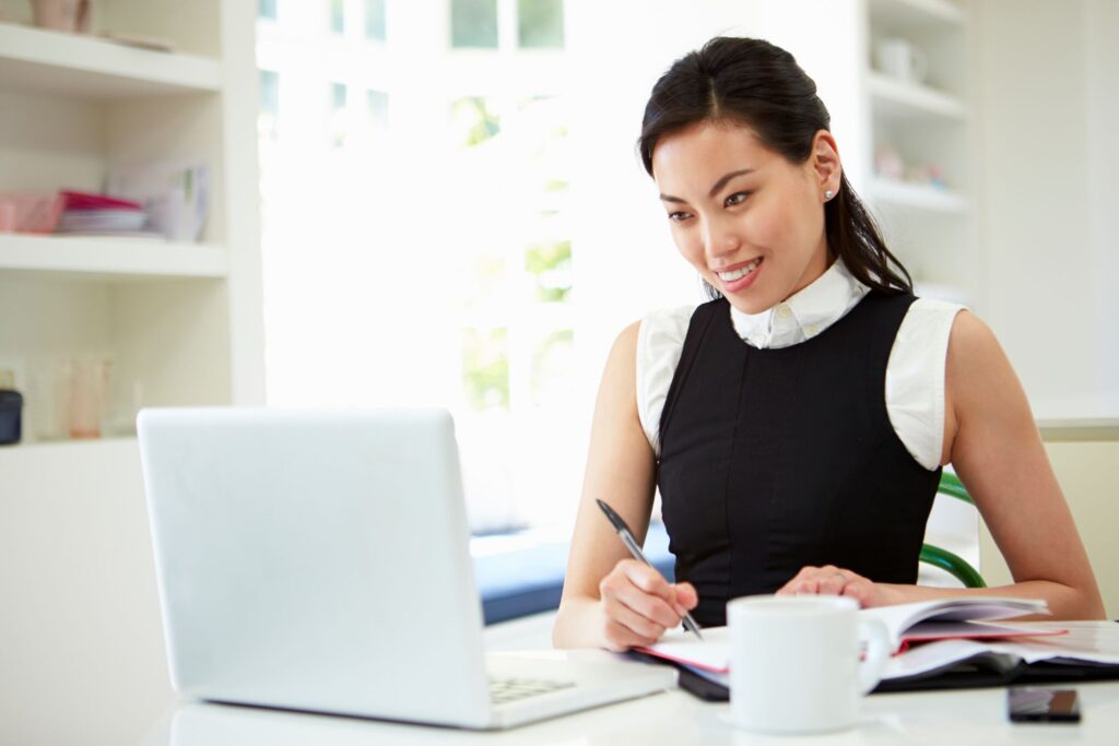 Executive assistant working at a laptop