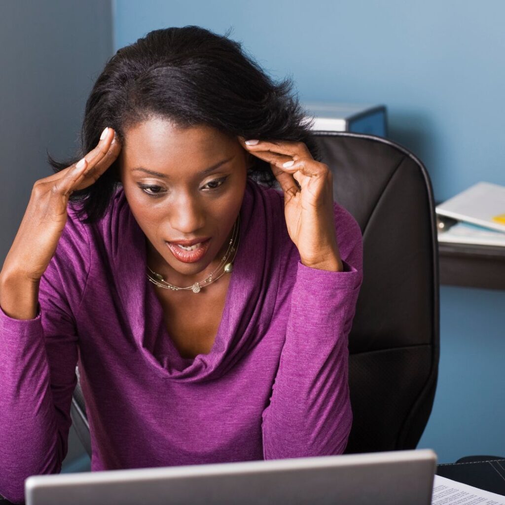 frustrated businesswoman in a purple blouse